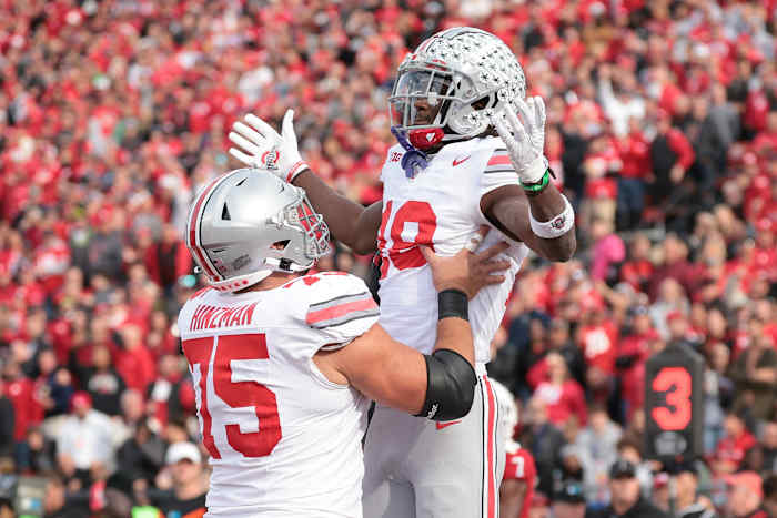 Nov 4, 2023; Piscataway, New Jersey, USA; Ohio State Buckeyes wide receiver Marvin Harrison Jr. (18) celebrates with offensive lineman Carson Hinzman (75) after scoring a touchdown against the Rutgers Scarlet Knights during the second half at SHI Stadium. Mandatory Credit: Vincent Carchietta-USA TODAY Sports